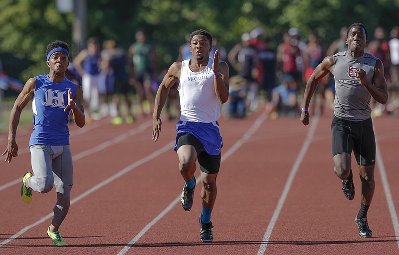 McCallie's J.J. Lewis, center, competes in the 100 meter dash with St. George's Chazz Simmons, right, and Harding Academy's Calvin Austin, III, during the boys track and field state championships at the TSSAA Spring Fling in Murfreesboro, Tenn. on May 21, 2015.