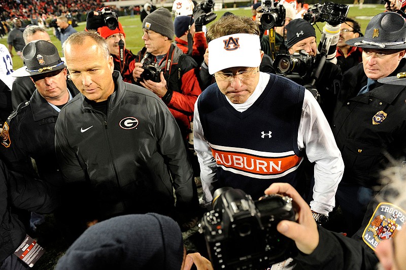 Georgia football coach Mark Richt, left, is hoping for a more level playing field in cost of attendance since Richt's Bulldogs are not offering as much as Auburn and Gus Malzahn. (UGA photo/John Kelley)