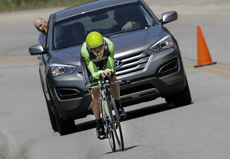 A team member shouts to 2nd place finisher Ben King from a chase vehicle as he competes in the men's U.S. Pro Cycling time trials competition Saturday, May 23, 2015, in Chattanooga. King took 2nd place behind winner Andrew Talansky and ahead of 3rd place finisher David Williams.