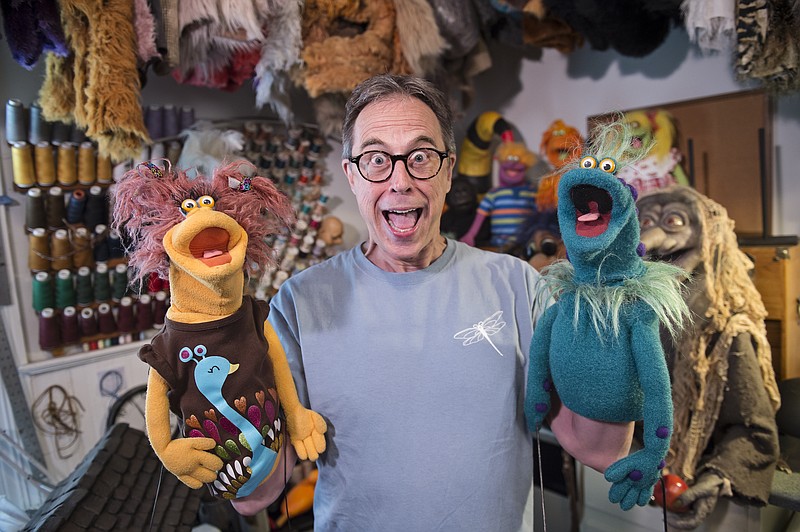 
              In this photo taken on Thursday, May 14, 2015, puppeteer Keith Bailey, poses in his workshop in Augusta, Ga. Over the years, Bailey has created puppets, mascots, party-themed sets and birdhouses. For most of Bailey’s career, he built mascots, including mascot Izzy for the 1996 Olympics. (Jon-Michael Sullivan/The Augusta Chronicle via AP)
            