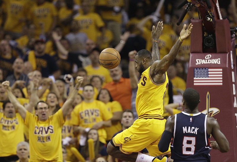 
              Cleveland Cavaliers' LeBron James finishes a dunk against the Atlanta Hawks during the first half in Game 3 of the Eastern Conference finals of the NBA basketball playoffs Sunday, May 24, 2015, in Cleveland. (AP Photo/Tony Dejak)
            