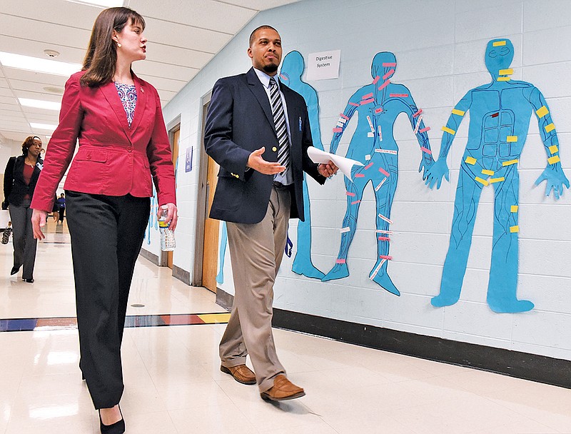 Tennessee Education Commissioner Candice McQueen, left, walks and talks with Dalewood Middle School Principal Chris Earl during a tour of classrooms in this file photo.