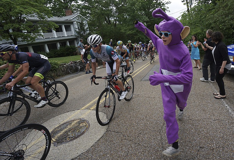 Chattanooga resident Hal Wiman dressed as a Teletubbies cheers for racers as they near the KOM atop Lookout Mountain on Monday, May 25, 2015, during the 2015 Volkswagen USA Cycling Pro Road & Time Trial National Championships in Chattanooga.