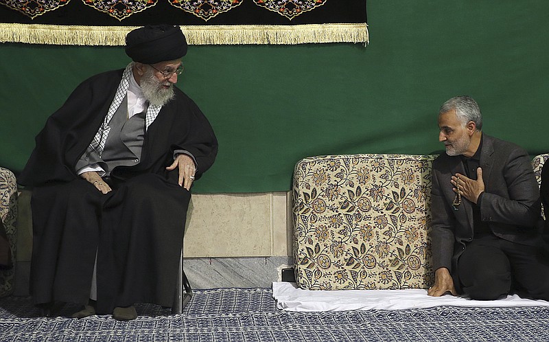 
              FILE - In this Friday, March 27, 2015 file photo released by the official website of the office of the Iranian supreme leader, commander of Iran's Quds Force, Qassem Soleimani, right, greets Supreme Leader Ayatollah Ali Khamenei while attending a religious ceremony in a mosque at his residence in Tehran, Iran. The chief of an elite unit in Iran's Revolutionary Guard has accused the U.S. of having "no will" to stop the Islamic State group after the fall of the Iraqi city of Ramadi, an Iranian newspaper reported Monday. (Office of the Iranian Supreme Leader via AP, File)
            