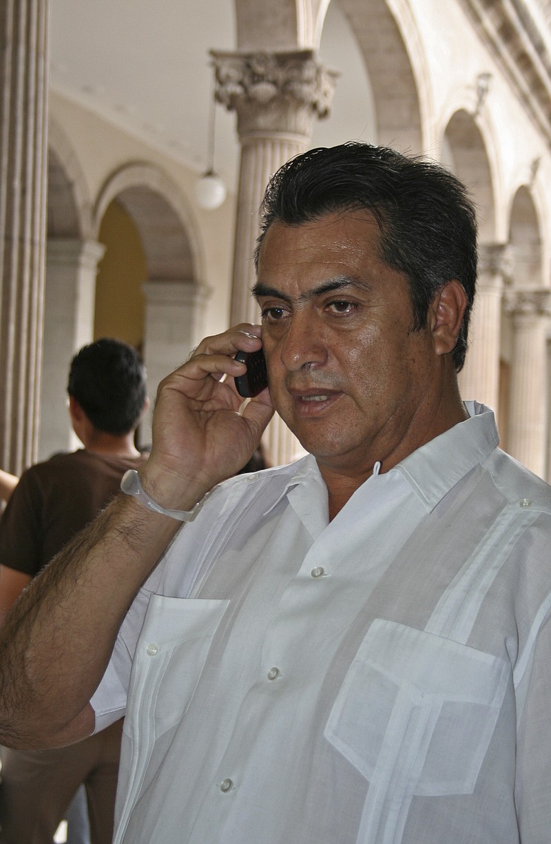 
              FILE - In this March 30, 2011 file photo, Jaime Rodriguez, mayor of the Mexican town Villa Garcia, speaks on a cellphone in Monterrey, Mexico, a day after he survived an assassination attempt. As mayor of a suburb of the northern industrial city of Monterrey, Rodriguez survived two assassination attempts that left his car bullet-ridden, defying, he says, the fierce Zetas cartel. Now he is trying to beat the odds in another way, running as an independent for governor of Nuevo Leon, a wealthy and strategic state bordering Texas. (AP Photo, File)
            