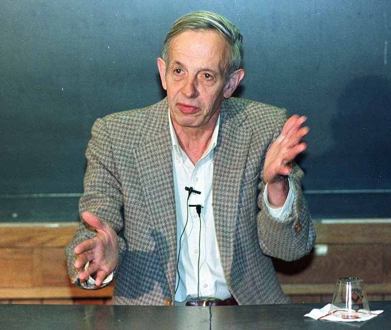 In this Oct. 11, 1994, file photo, Princeton University professor John Nash speaks during a news conference at the school in Princeton, N.J., after being named the winner of the Nobel Peace Prize for economics.