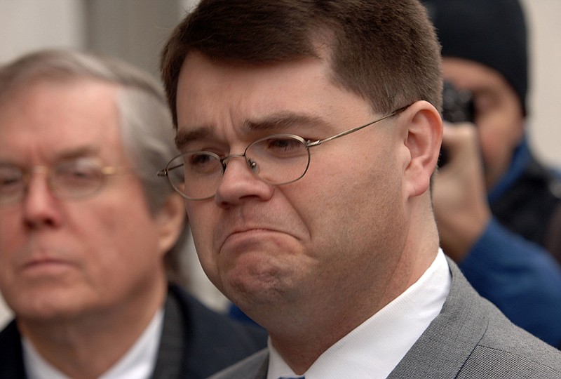 In this Feb. 22. 2006, file photo, former Rep. Chris Newton reacts after reading a statement to the press outside the Clifford Davis Federal Building in Memphis, Tenn., after being sentenced to one year in prison after pleading guilty to bribery charges in the FBI's Tennessee Waltz sting operation. 
