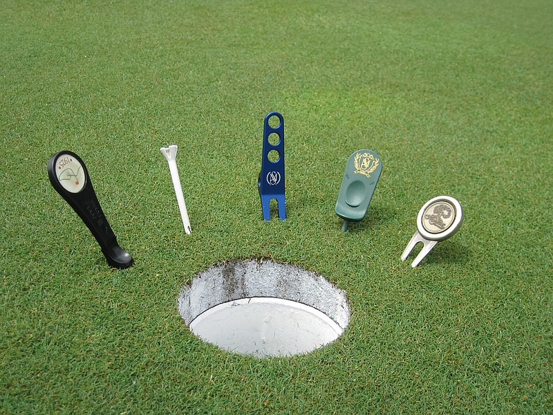 Divot tools come in a variety of shapes and sizes and can be found in almost any pro shop. Pat Rose, Signal Mountain Golf and Country Club superintendent, prefers to use nothing more than a golf tee.