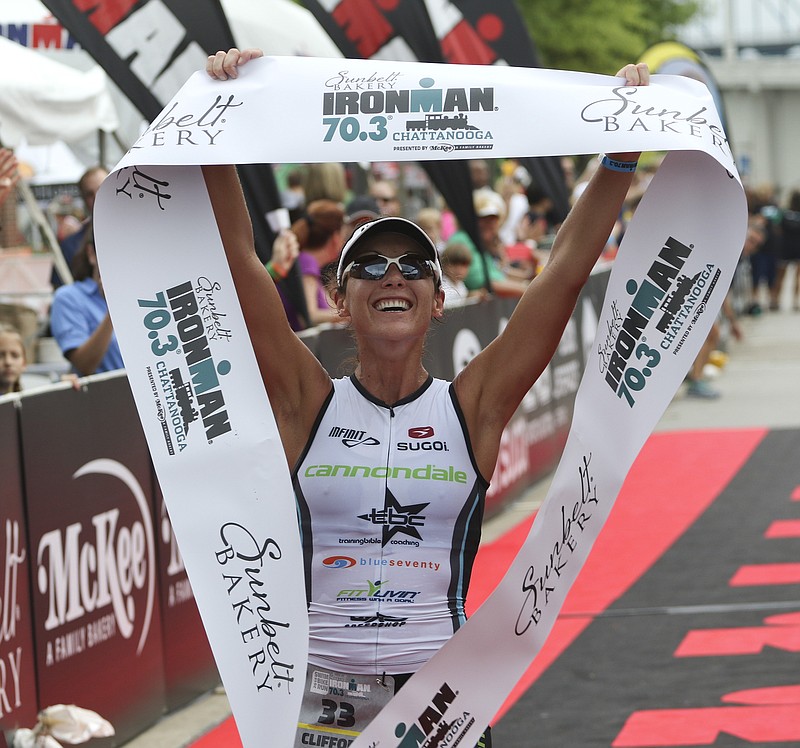 Ashley Clifford celebrates her win during the 2015 Sunbelt Bakery Ironman 70.3 Chattanooga race on Sunday, May 17, 2015.