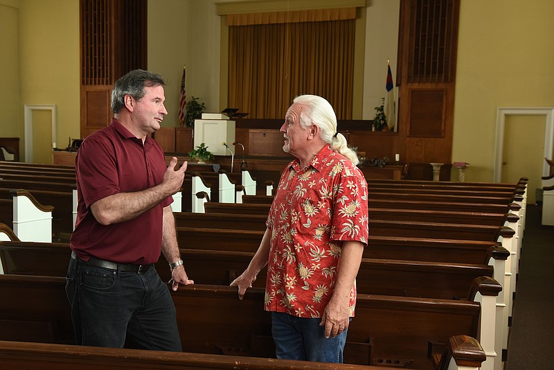 Pastor Tony Walliser of the Silverdale Baptist Church, left, talks with Pastor Roger Kittle at the St. Elmo Avenue Baptist Church.