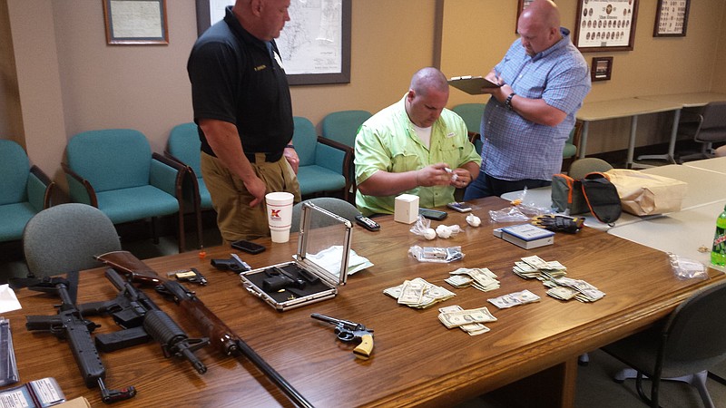 Three people, a man and woman from Sweetwater and another man from Philadelphia in Loudon County were booked on a string of drug and gun charges in a search, according to McMinn County Sheriff Joe Guy.