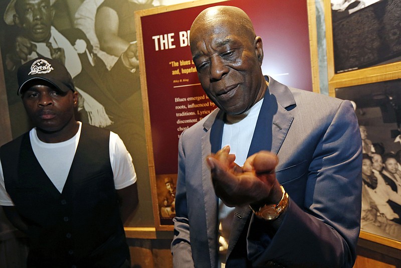 
              George "Buddy" Guy, a Chicago blues and electric blues guitarist speaks about  B.B. King's technique with reporters after filling past the casket during a public viewing Friday, May 29, 2015 in the B.B. King Museum and Delta Interpretive Center in Indianola, Miss. The visitation comes a day before the funeral for the man who influenced generations of singers and guitarists. (AP Photo/Rogelio V. Solis)
            