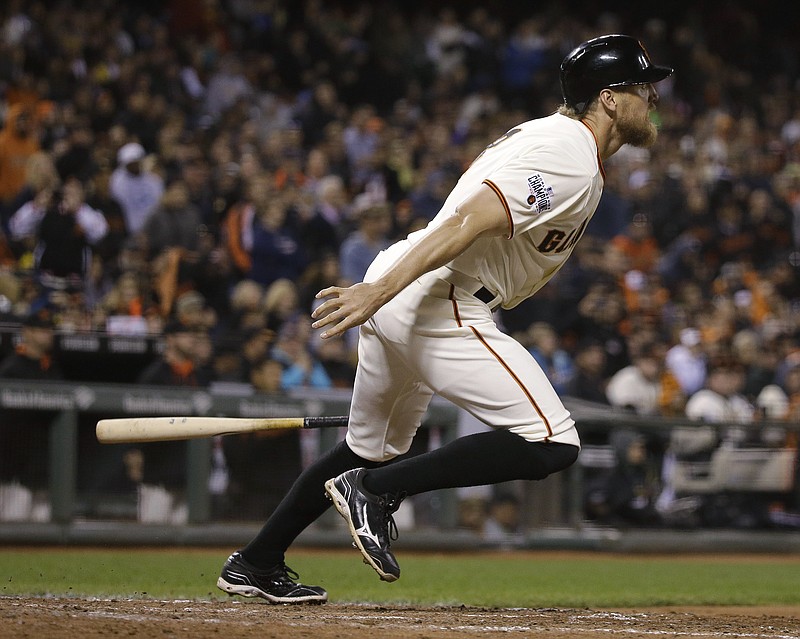 San Francisco Giants' Hunter Pence drops his bat on a two-run triple off Atlanta Braves relief pitcher Brandon Cunniff in the eighth inning of a baseball game Thursday, May 28, 2015, in San Francisco. 