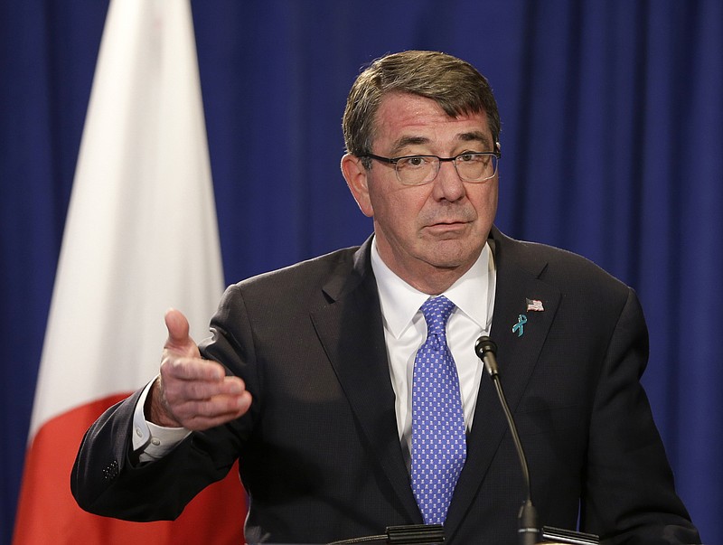 
              FILE - In this April 27, 2015 file photo, Defense Secretary Ash Carter speaks during a news conference in New York. Two large artillery vehicles were detected on one of the artificial islands that China is creating in the South China Sea, U.S. officials said Friday, underscoring ongoing concerns that Beijing may try to use the land reclamation projects for military purposes. (AP Photo/Seth Wenig, File)
            