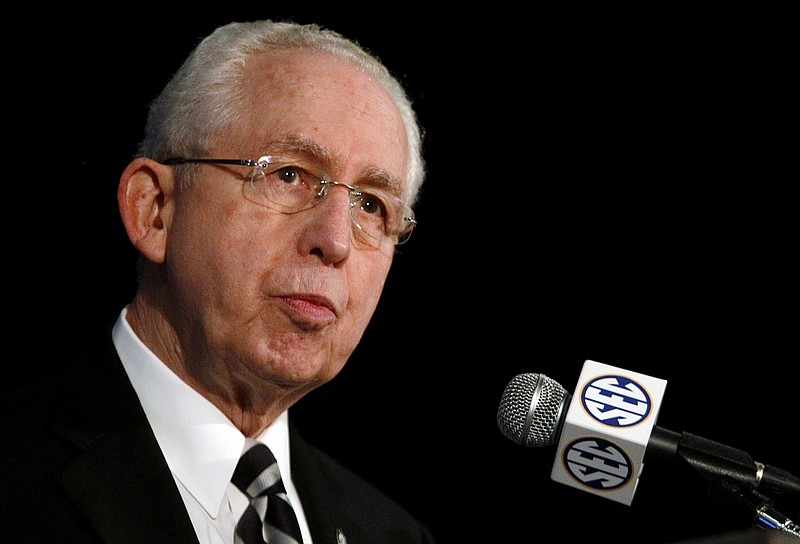 In this July 14, 2014, file photo, Southeastern Conference Commissioner Mike Slive speaks during SEC media days in Hoover, Ala. 