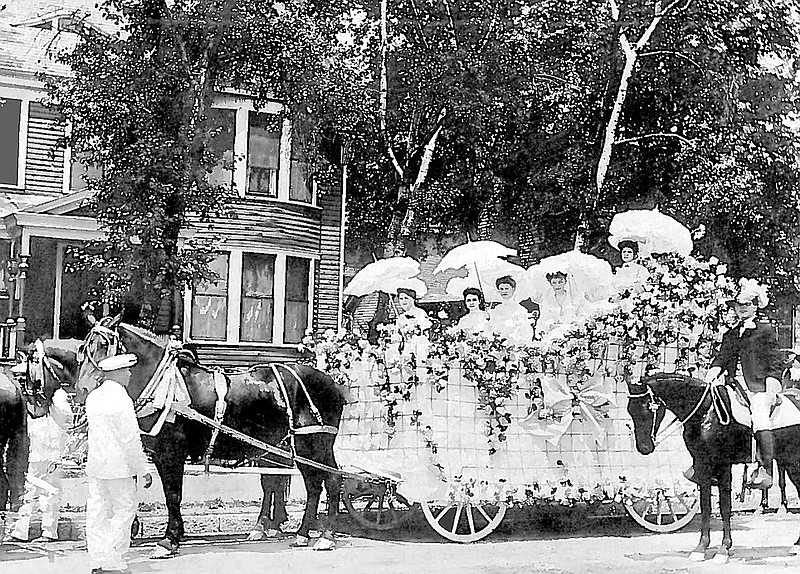 The horse-drawn St. Elmo float is decked out in flowers for the city's 1906 Spring Festival. Among the women on the float are Amy Acheson Nixon, left, Sophie Scholze Long, center, and Nell Griscom, right.