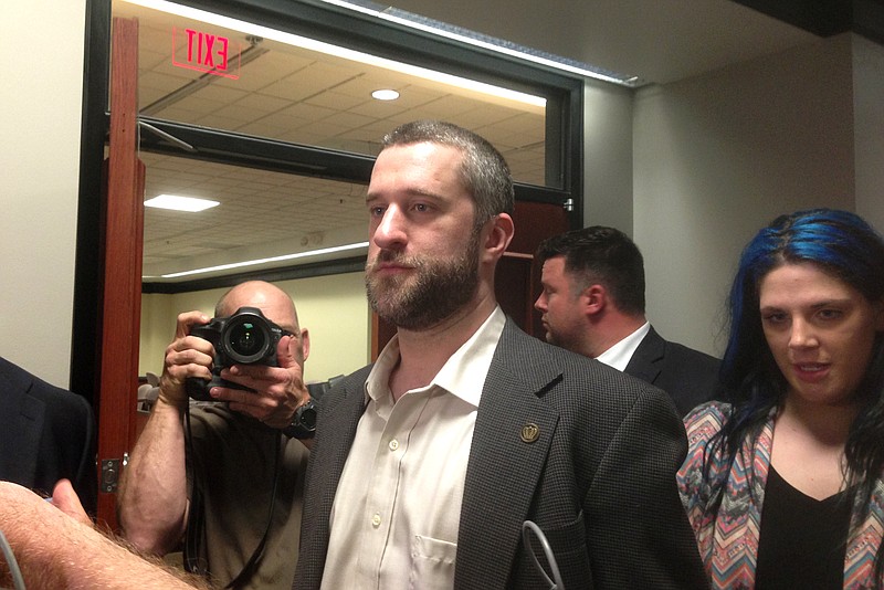 Television actor Dustin Diamond, center, exits the courtroom in Port Washington, Wis., Friday night, May 29, 2015, after a 12-person jury convicted him of two misdemeanors stemming from a barroom fight, but a Wisconsin jury cleared the former "Saved by the Bell" actor of the most serious felony charge.