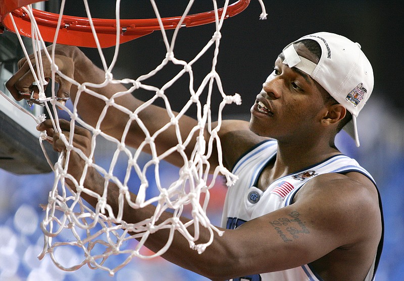 North Carolina's Rashad McCants cuts down part of the net during UNC's celebration following their 75-70 win over Illinois in the 2005 NCAA championship game in St. Louis.