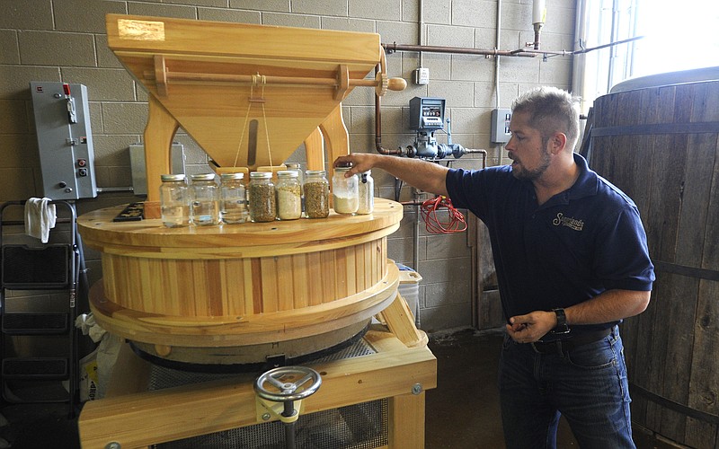 In this April 16, 2015, photo, head distiller Greg Eidam talks about the distilling process at Sugarlands Distilling Company in Gatlinburg, Tenn.