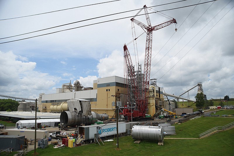 Work continues Monday to install a 220-foot high pulp digester, or cooker, and other wood-chip processing equipment at Resolute Forest Products.