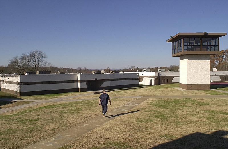 An inmate walks across the yard inside at the Silverdale correctional facility, located on Standifer Gap Road in East Brainerd.