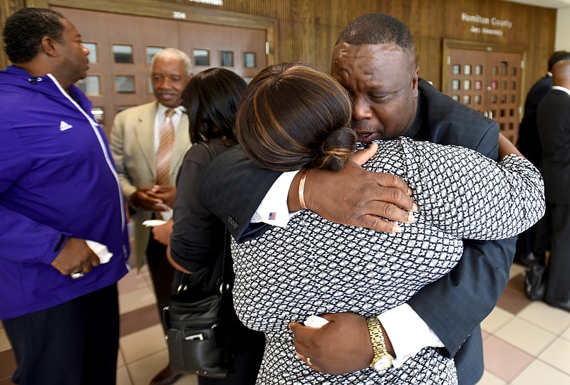 Richard Bennett hugs his wife, Jessica Bennett, Tuesday after Judge Barry Steelman acquitted him on a marijuana charge.