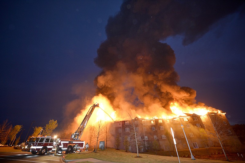 Firefighters battle a blaze at the Marshall Square Retirement Resort in Evans, Ga., on Tuesday, June 2, 2015.