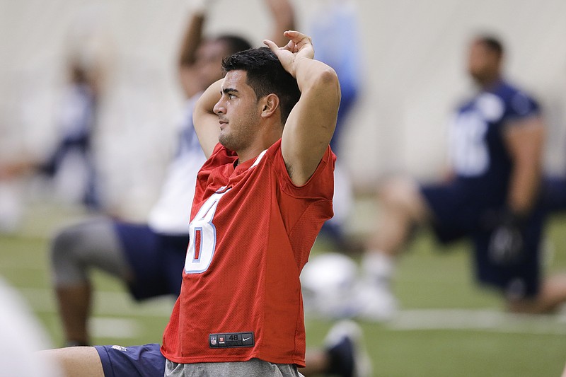 Tennessee Titans quarterback Marcus Mariota stretches during an organized team activity at the team's NFL football training facility Tuesday, June 2, 2015, in Nashville.