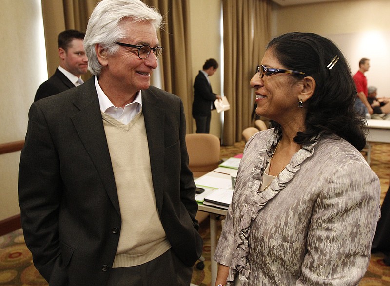 Dr. Advisory board member Tim Anderson, left, speaks to Sheila Boyington, co-founder of Thinking Media, in this 2012 file photo.