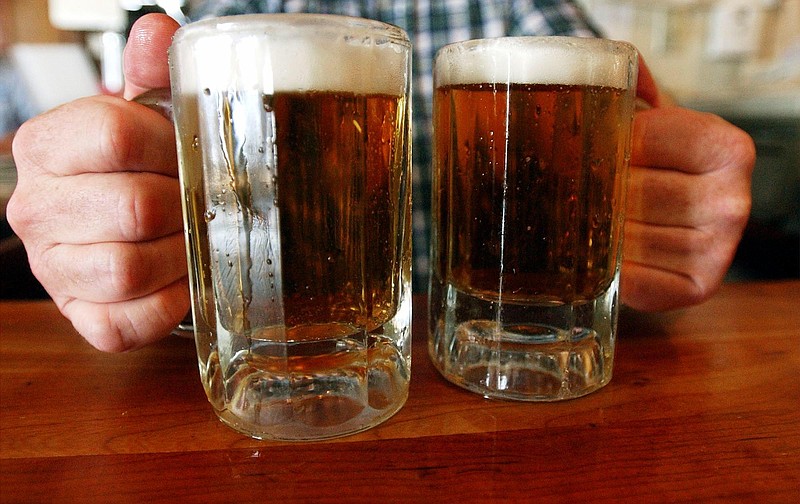 
              FILE - In this  June 29, 2004 file photo, a bartender serves two mugs of beer at a tavern in Montpelier, Vt. Alcohol problems affect almost 33 million adults and most have never sought treatment. That's according to a government survey indicating that rates have increased in recent years.   (AP Photo/Toby Talbot, File)
            