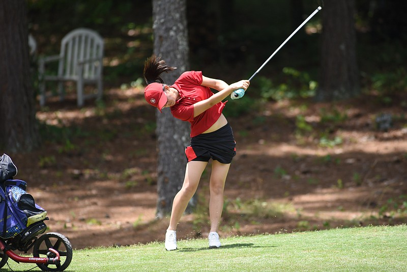 Jenny Bae, of Lawrenceville, Ga., hits her approach shot from the 17th fairway in the American Junior Golf Association tournament Thursday at Windstone Golf Club on June 04, 2015. Bae fired a 5-under, 208 to win the girls division.