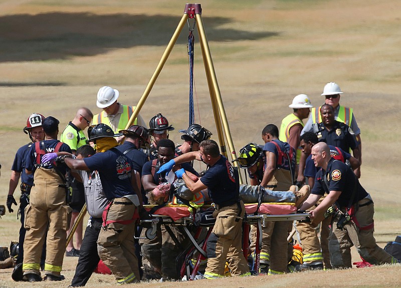 2 Trapped Workers Pulled From Manhole On Atlanta Golf Course 