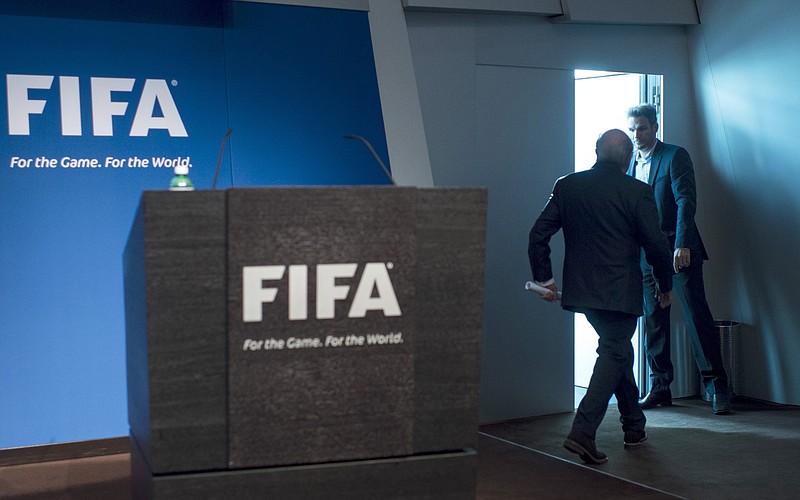 
              AP10ThingsToSee - FIFA President Sepp Blatter leaves after announcing his resignation from his position amid a corruption scandal at a press conference at the FIFA headquarters in Zurich, Switzerland, Tuesday, June 2, 2015. Blatter promised to call for fresh elections to choose a successor. (Ennio Leanza/Keystone via AP)
            