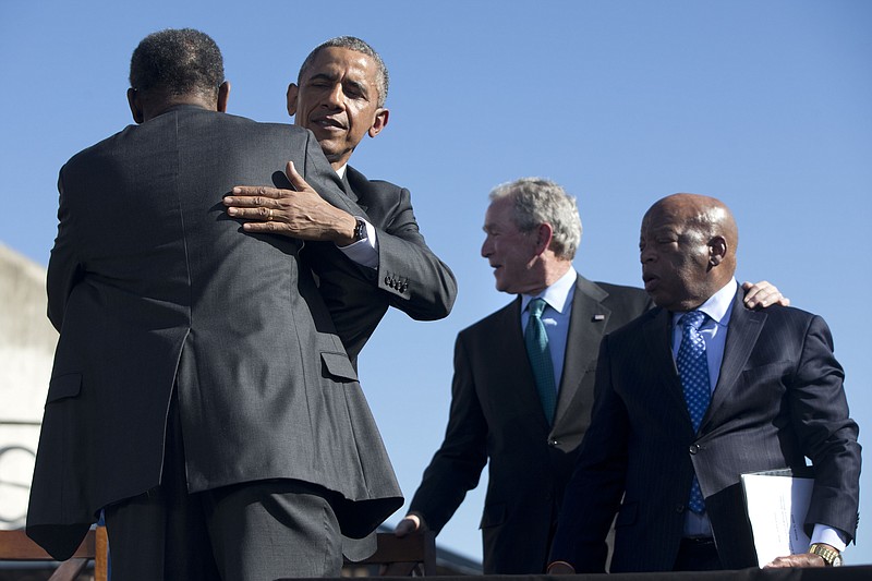 Former President George W. Bush, second from right, is now seen more favorably than President Barack Obama, second from left, in a recent survey by CNN.