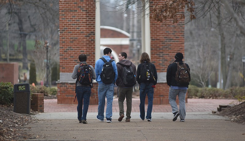 Students walk on a campus sidewalk at Lee University in Cleveland, Tenn., in this file photo.