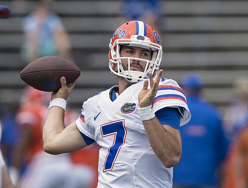 Florida quarterback Will Grier (7) loosens up his arm prior to the first half of Florida's Spring Orange-Blue  college football game  in Gainesville, FL, Saturday, April, 11, 2015. The Orange team won the game 31-6.  (AP Photo/Phil Sandlin)