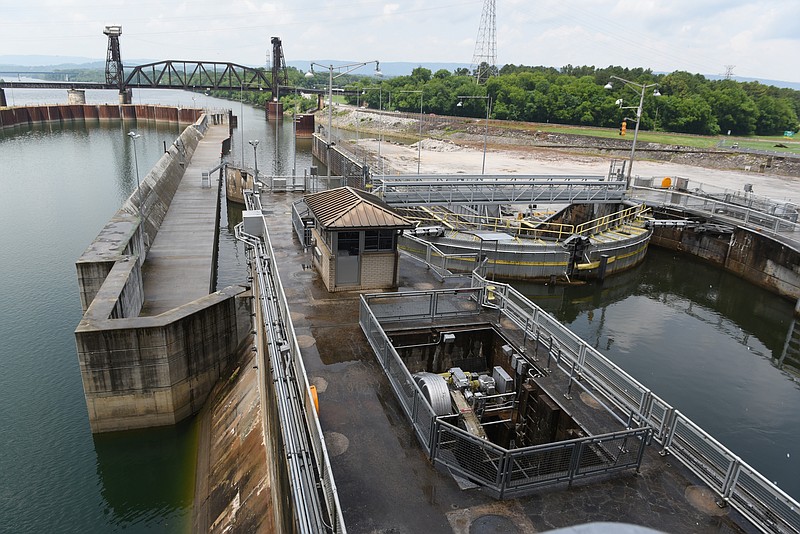 The troubled lock at the Chickamauga Dam is seen at right on Monday, June 8,  2015, in Chattanooga, Tenn. At left is a concrete wall that is the only part of the new lock that was completed before work was stopped due to funding issues. 