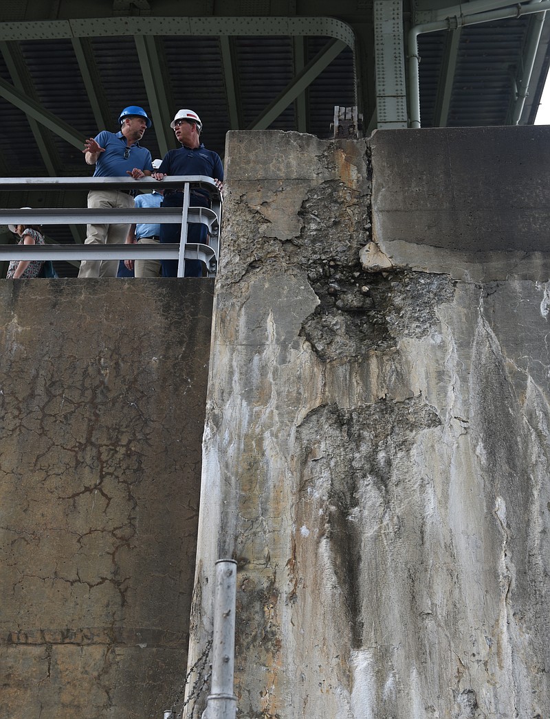 Don Lee of the Fort Loudon Terminal Company in Lenoir City, left, and Tate and Lyle plant manager Gerry Shlueter tour the lock at the Chickamauga Dam on Monday, June 8,  2015, in Chattanooga, Tenn.