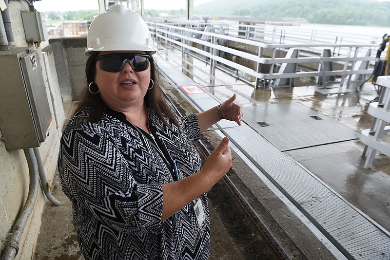 Jennifer Dodd, Dam Safety Officer for TVA, shows the place where the dam connects with the powerhouse at the Chickamauga Dam on Monday, June 8,  2015, in Chattanooga, Tenn. 