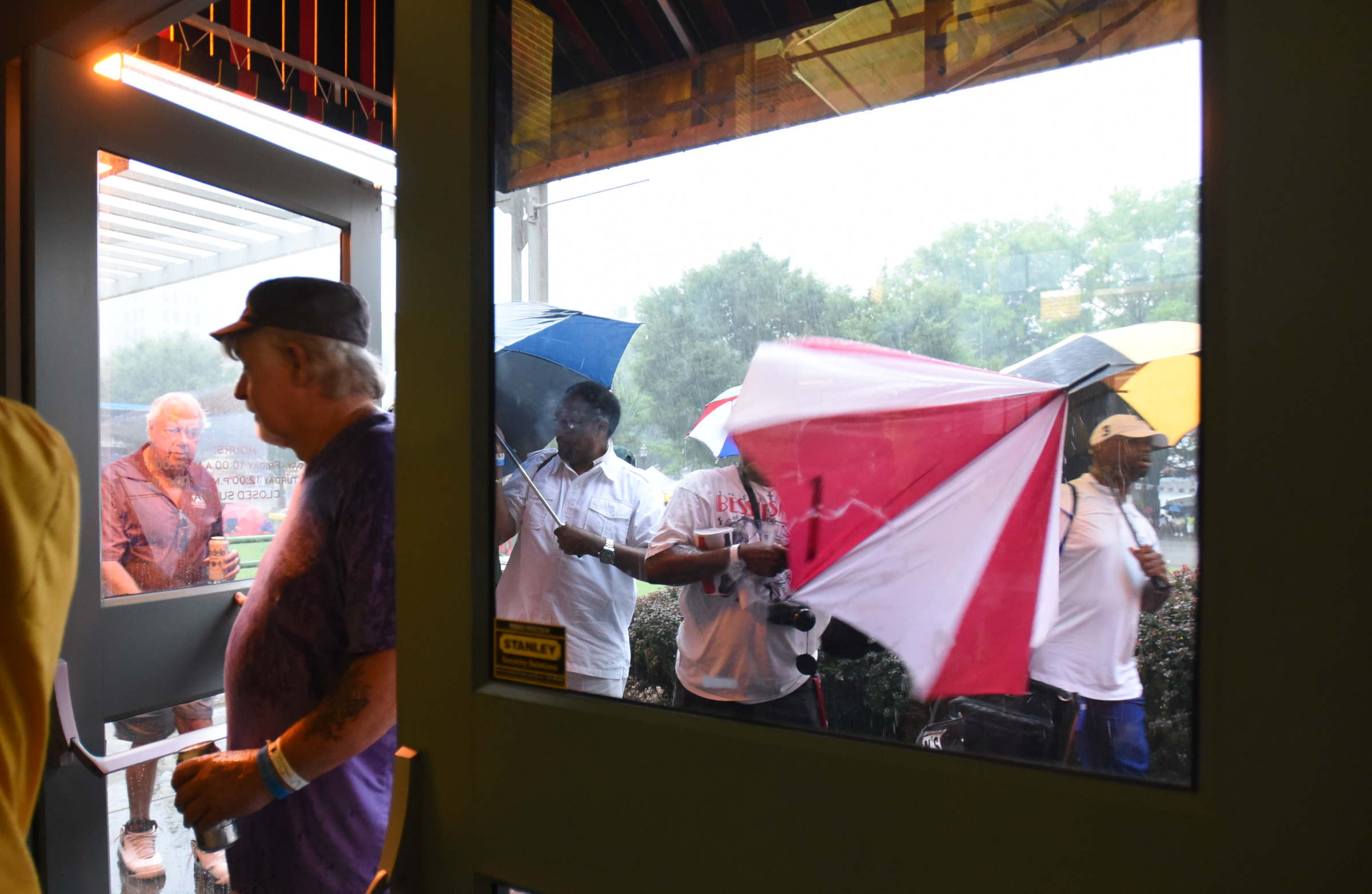 Staff Photo by Angela Lewis Foster/ The Chattanooga Times Free Press- 6/08/15
People flock into the Bessie Smith Cultural Center as a torrential downpour begins Monday at the Bessie Smith Strut.