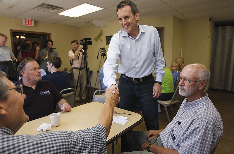 
              FILE - In this Aug. 9, 2011 file photo, then-Republican presidential candidate, former Minnesota Gov. Tim Pawlenty greets residents as he makes a campaign stop at Coffee Cup Cafe in Sully, Iowa. Pawlenty’s presidential hopes derailed long before the 2012 Iowa caucuses. But the former Minnesota governor’s short-lived campaign still casts a long shadow over Republicans now wooing voters in the state that kicks off the White House contest.  (AP Photo/Charles Dharapak, File)
            