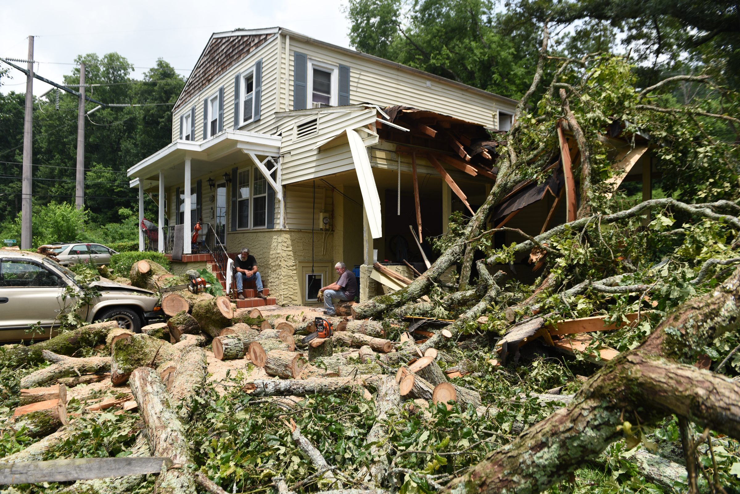 Staff photo by John Rawlston/Chattanooga Times Free Press - {iptcmonthname3 {iptcday}, 2015
Ronnie Morgan's house on West Crest Drive suffered damage to the carport and his truck from Monday night storms, seen Tuesday, June 9, 2015, in Rossville, Ga.