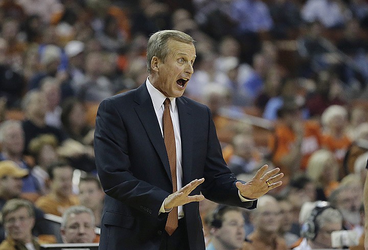 Texas head coach Rick Barnes talks with his players during the second half of an NCAA college basketball game against Oklahoma State, Wednesday, Feb. 4, 2015, in Austin, Texas. Oklahoma State won in overtime 65-63. (AP Photo/Eric Gay)