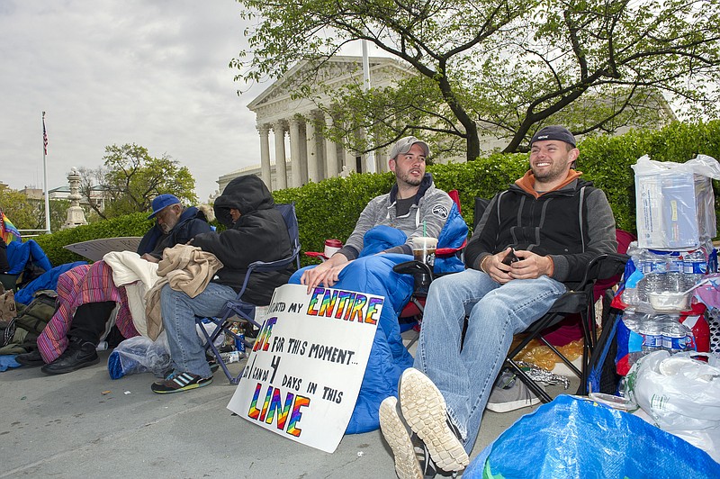 Associated Press File PhotoSame-sex marriage opponents Sean Varsho, 28, of Chicago, left, and Brandon Dawson, 26, of Warrantor, Va., wait in line for a seat on the Supreme Court's gay marriage hearing in April.