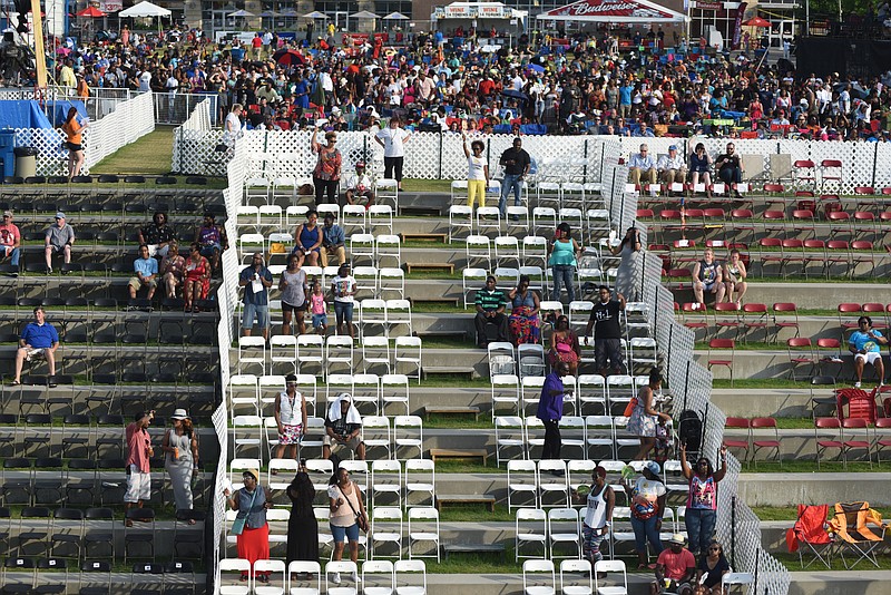 Staff photo by John Rawlston/Chattanooga Times Free Press -Attendees watch as Doug E. Fresh performs the early show on the Coca Cola Stage at the Riverbend Festival on Wednesday, June 10, 2015, in Chattanooga, Tenn. Reserved seating is seen below the white fence.