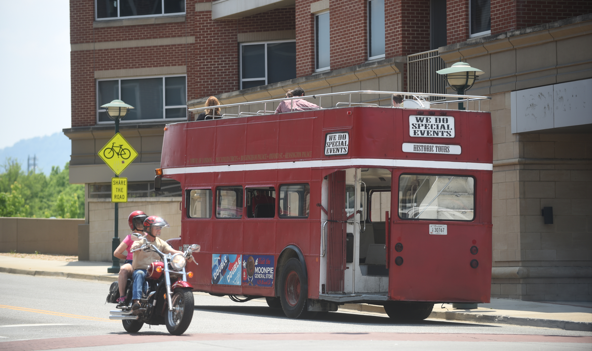 The double-decker bus turns onto the Market Street Bridge during a tour Saturday afternoon. The bus has a cameo in the new Captain America movie that is being made now.