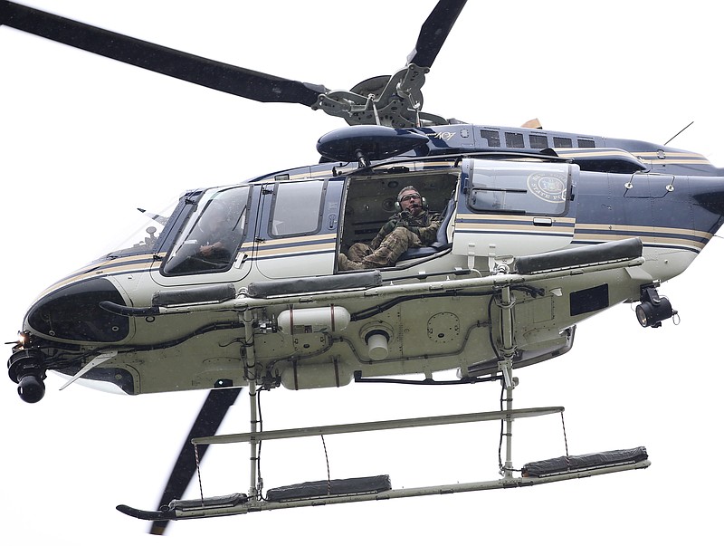 A law enforcement helicopter searches for two escapees from Clinton Correctional Facility on Friday, June 12, 2015, near Dannemora, N.Y.