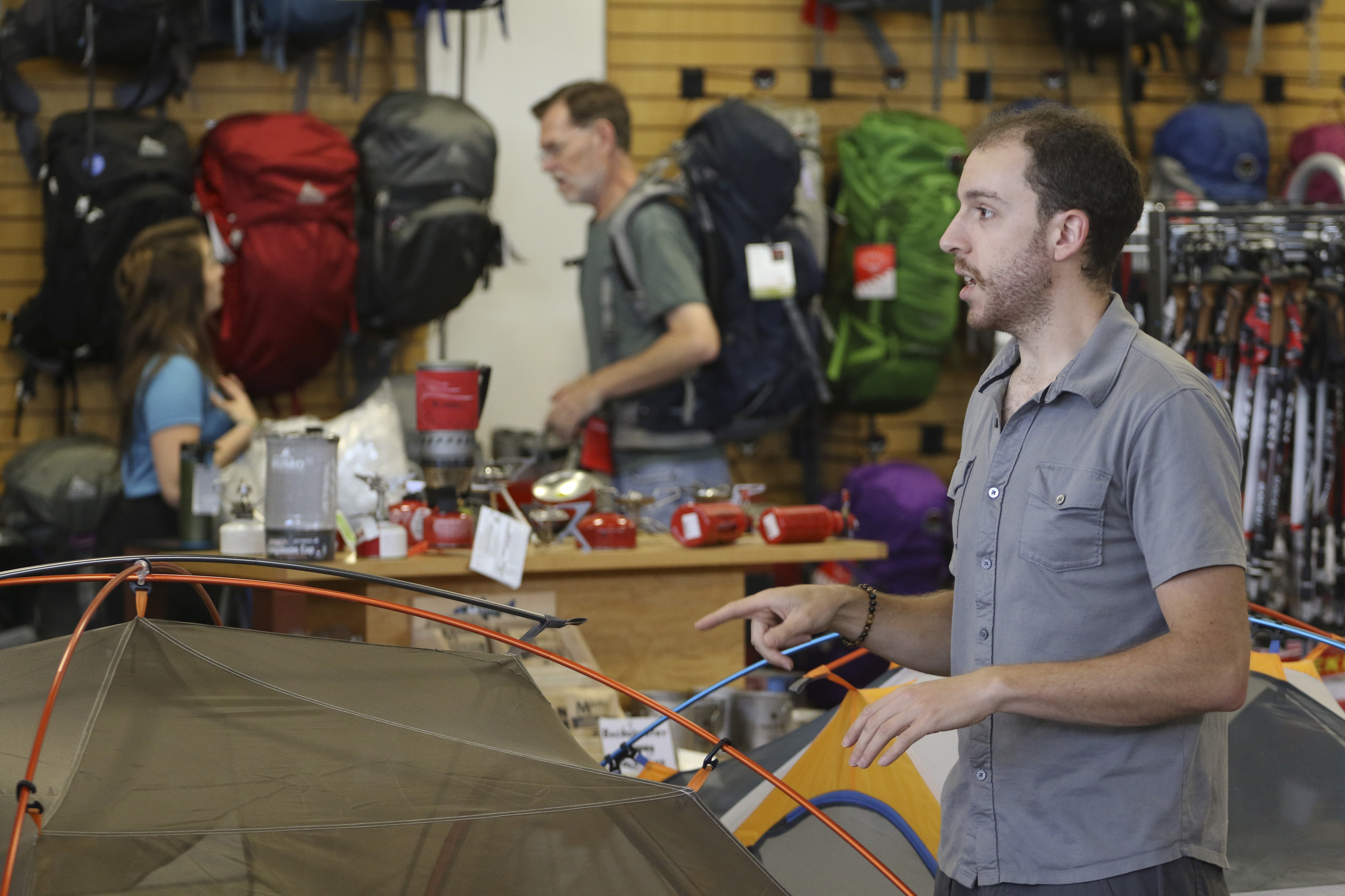 Staff Photo by Dan Henry / The Chattanooga Times Free Press- 6/9/15. Jeremy Parker assists customers demonstrating how to set up Marmot's