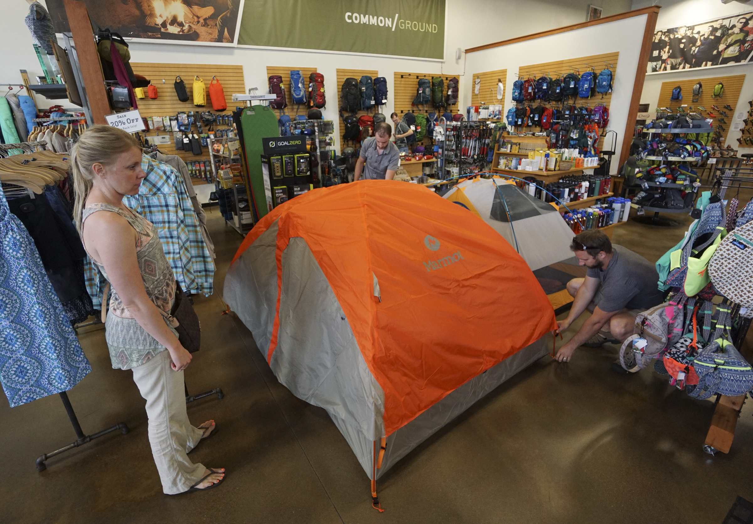 Staff Photo by Dan Henry / The Chattanooga Times Free Press- 6/9/15. Jeremy Parker, back middle, assists Serena and Darren Cooper demonstrating how to set up Marmot's