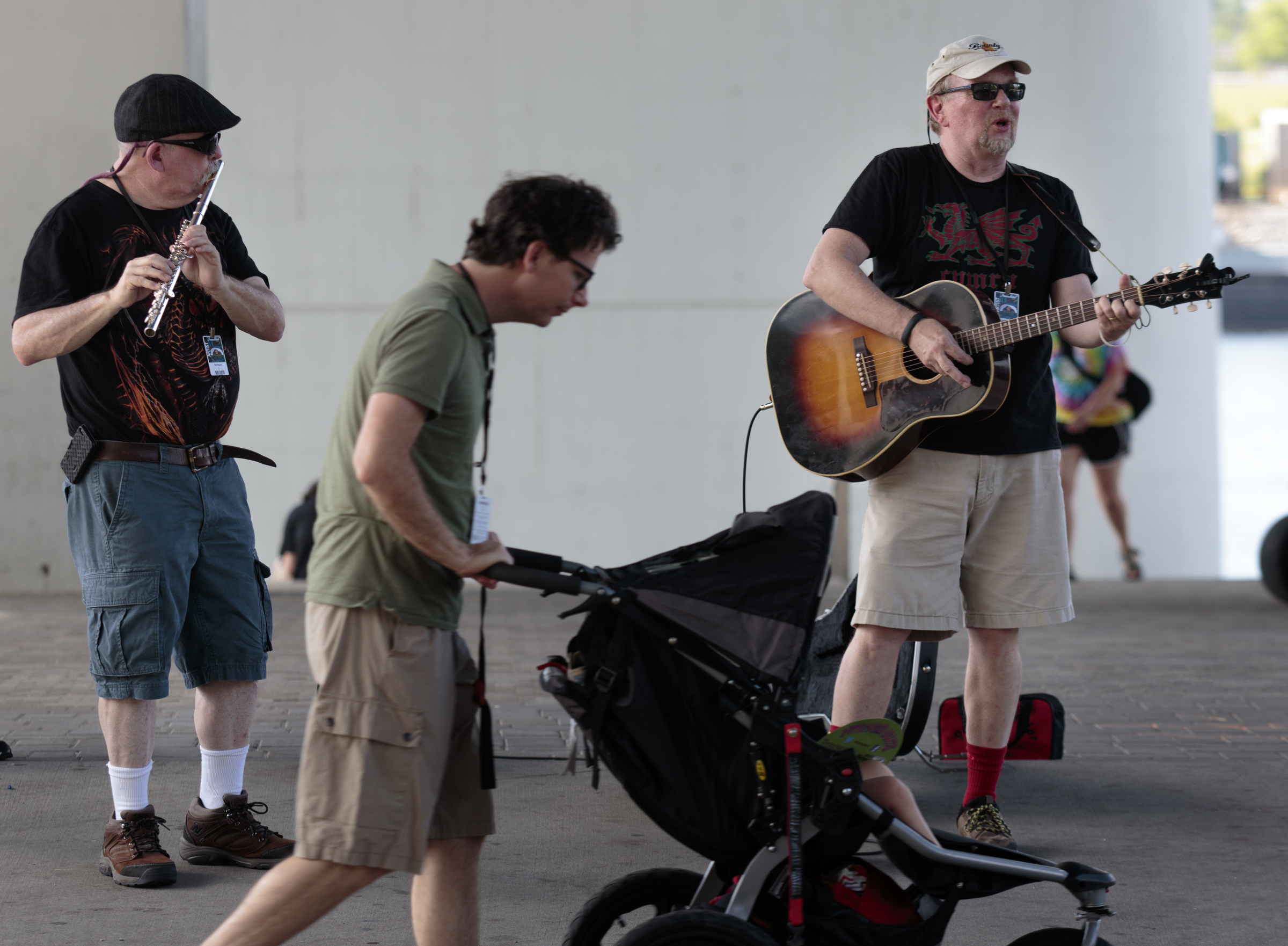 Staff photo by Doug Strickland
Bill Lee, right, and Tommy Lifsey, left, of the Red Rogues band, play beneath the Olgiati Bridge as people enter the final day of the Riverbend Festival on Saturday, June 13, 2015, in Chattanooga, Tenn. Headliner Stone Temple Pilots closed the festival.